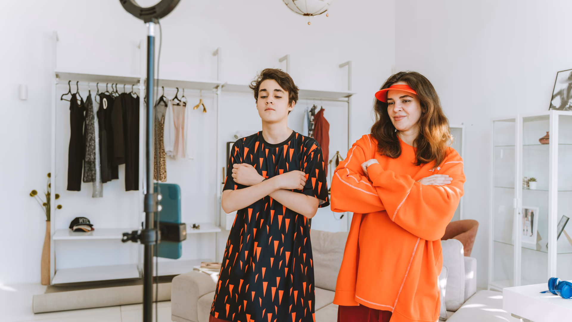 A mother and son record a fun dance video at home using a smartphone and ring light - Image by Anastasia Shuraeva from Pexels