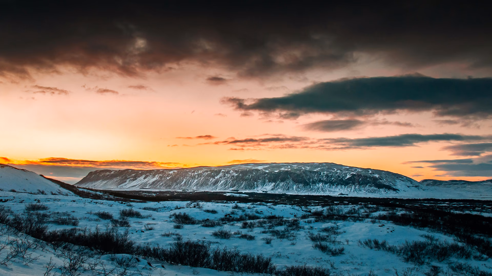 Breathtaking sunset over snowy Icelandic landscapes with dramatic clouds - Image by Rach Wang from Pexels