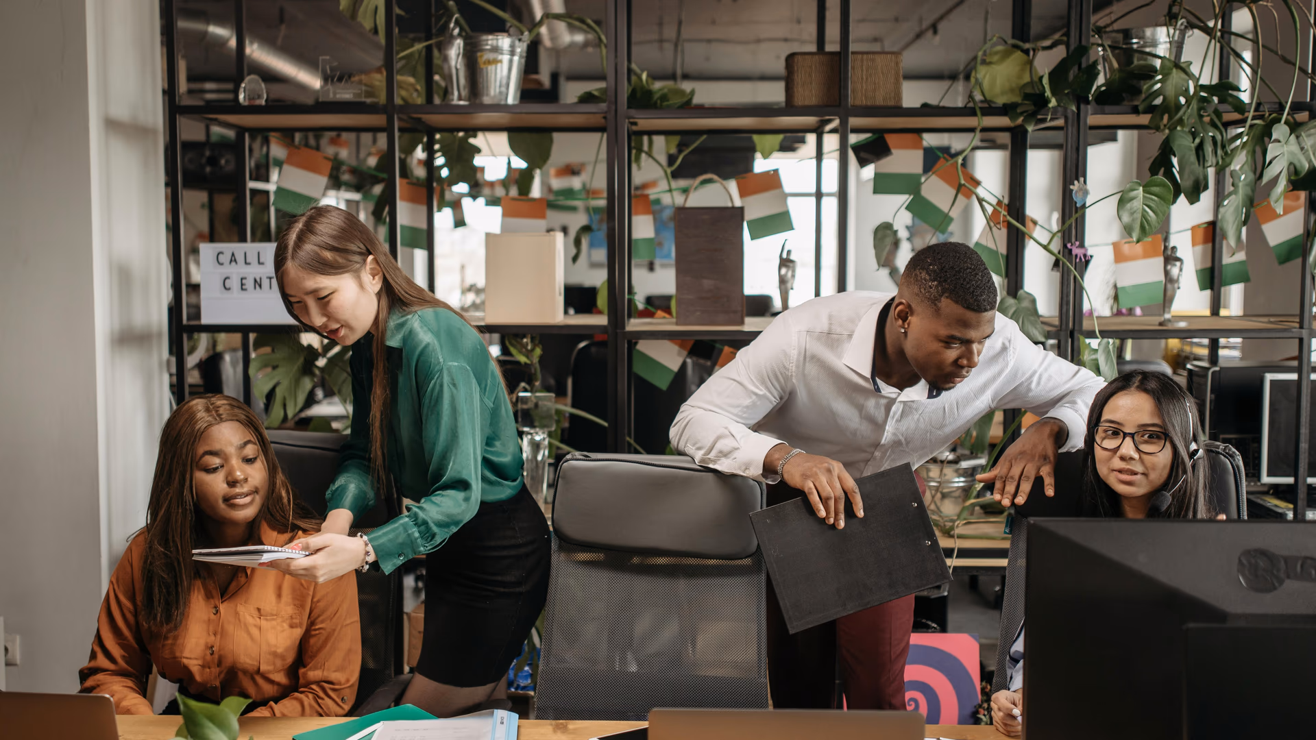A diverse group of co-workers engaged in communication and teamwork in a call center environment - Image by Pavel Danilyuk from Pexels