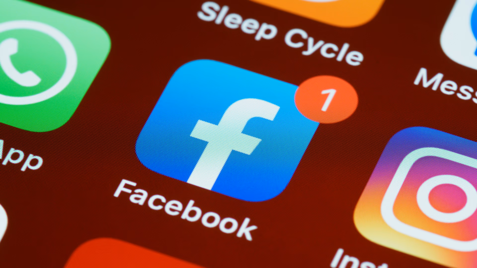 A detailed close-up of social media app icons on a smartphone screen - Image by Brett Jordan from Pexels