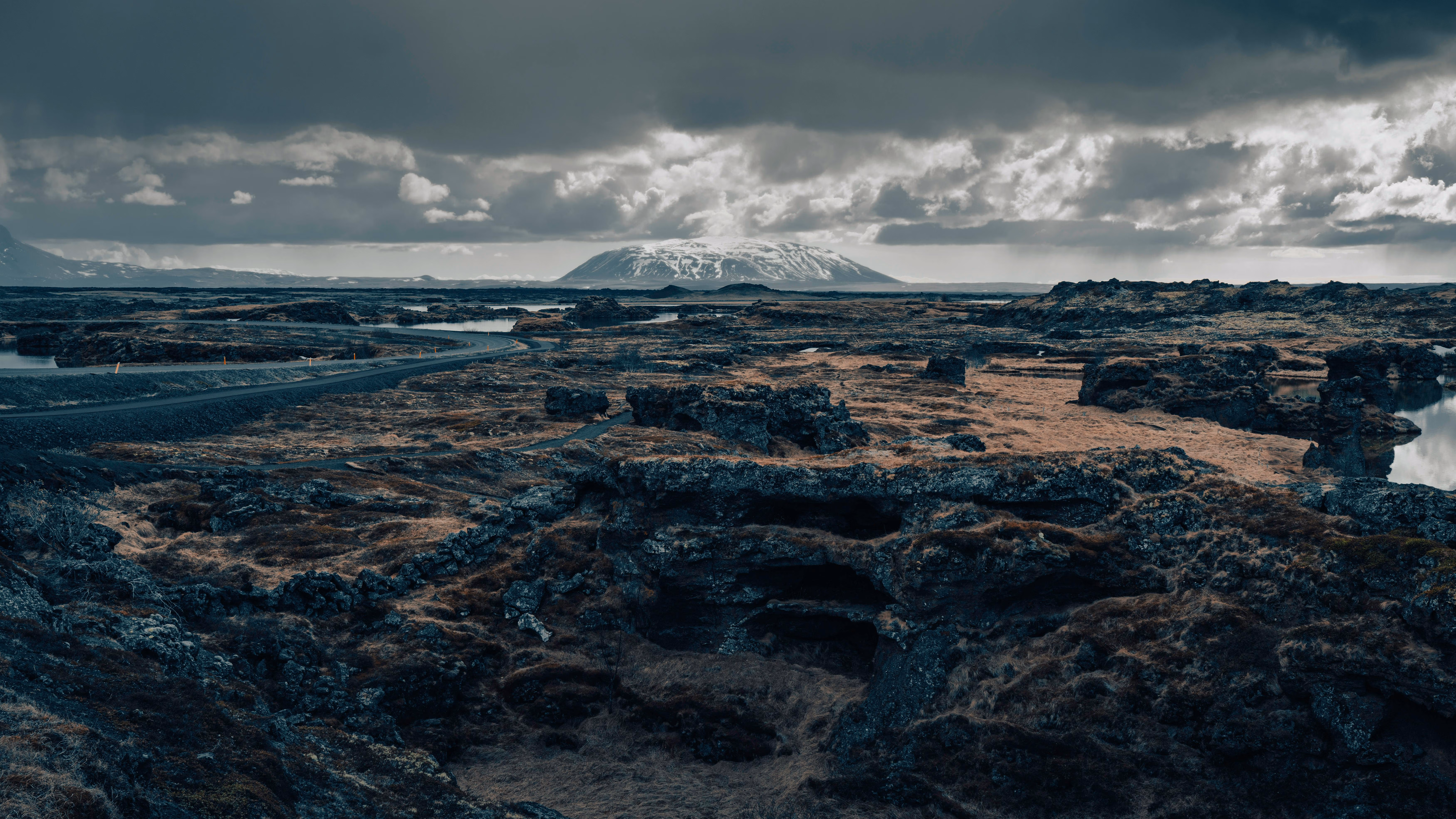 Explore Iceland's stunning volcanic terrain and distant mountains under moody skies - Images by Raul Ling from Pexels